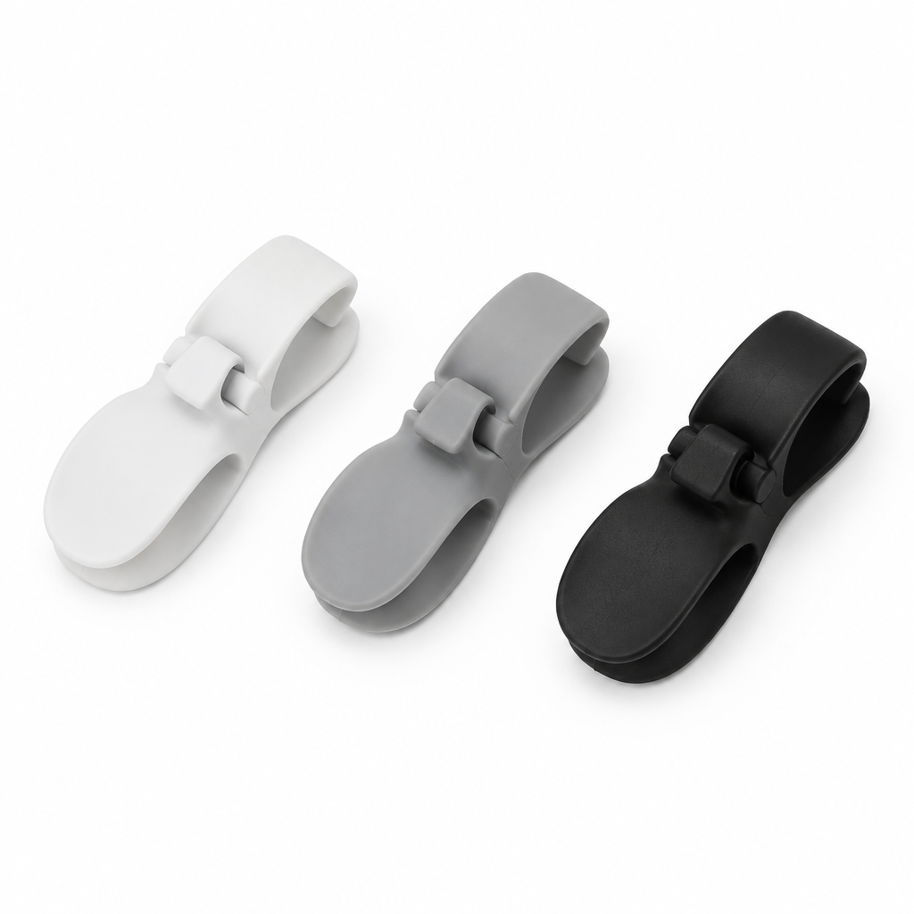 Cable wire winder clips in white grey and black flat lay on white background